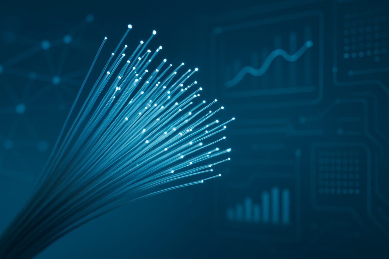 a close-up view of fiber optic cables emitting light against a dark background