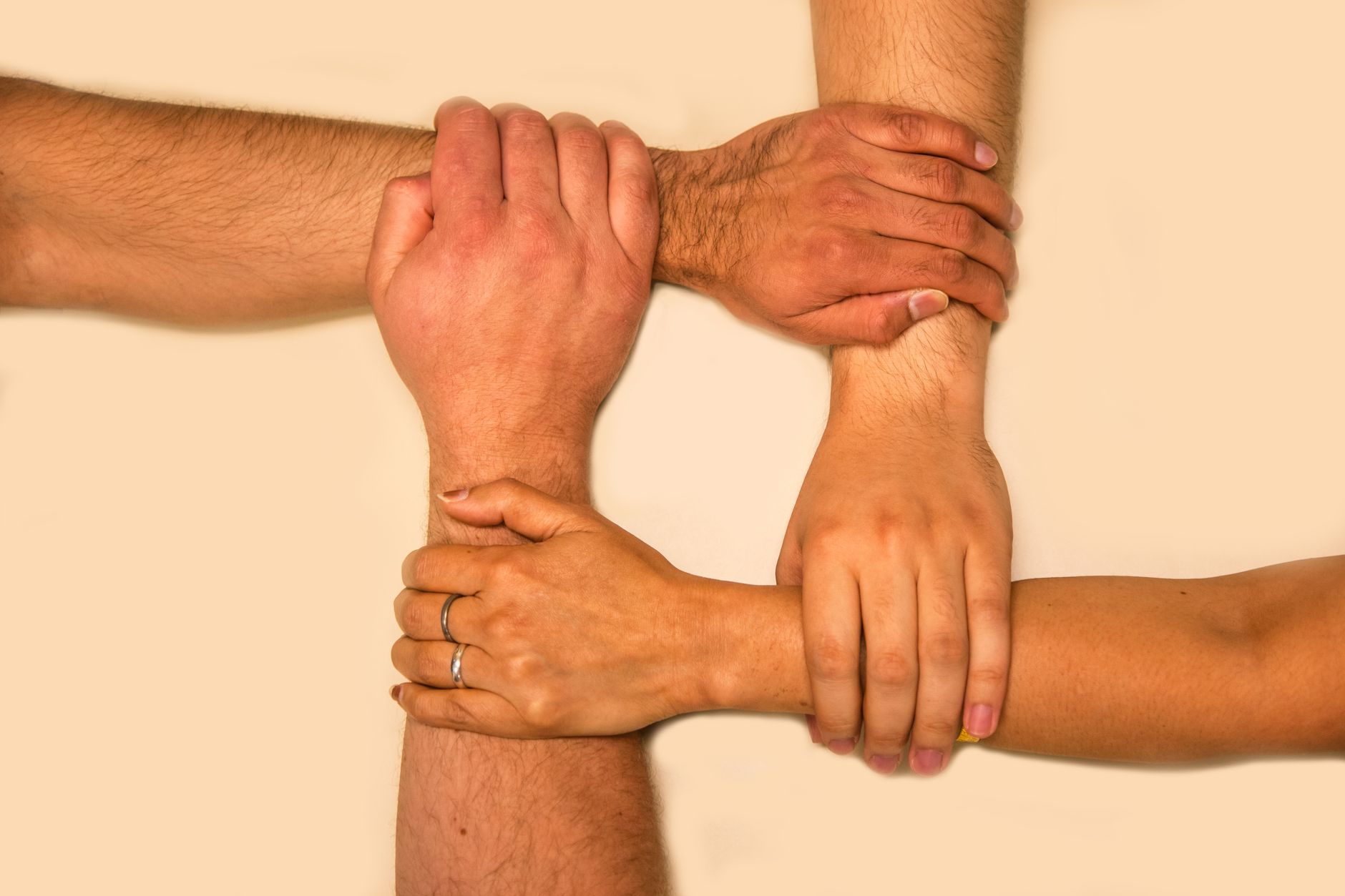 Intersecting hands showing teamwork and collaboration